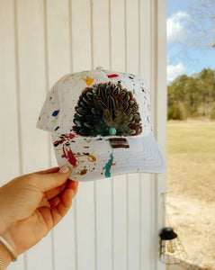 HART DESIGNS White Splatter Paint Feather Trucker Hat w/ Turquoise